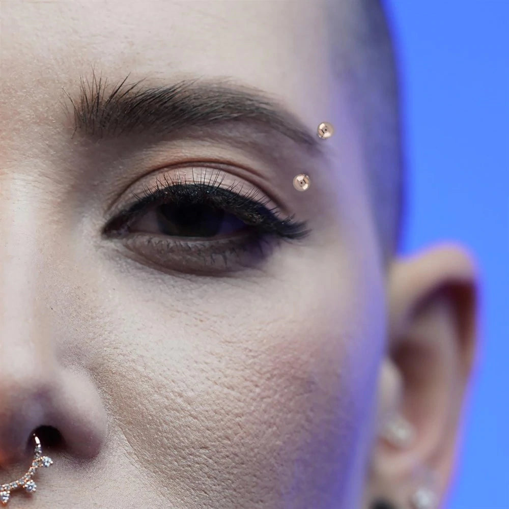 Golden Ball Eyebrow Piercing Vanhess
